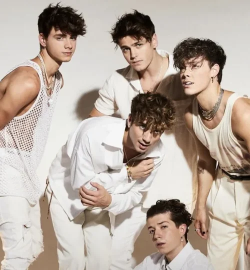 Gen Z boys posing in stylish all-white outfits